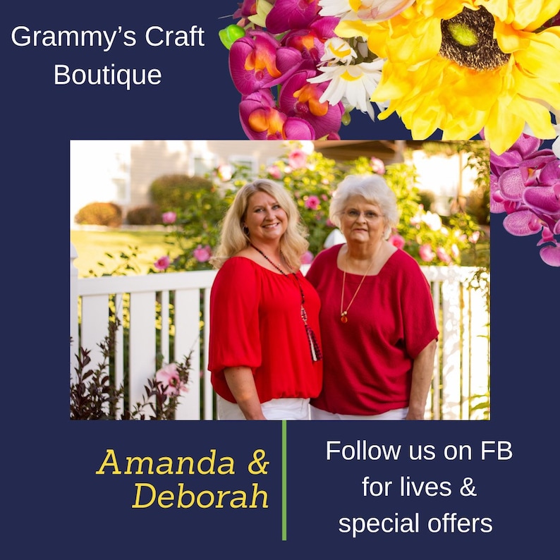 May include: An image featuring two women in red tops and white pants, standing in front of a white fence and greenery. The text "Grammy's Craft Boutique" is at the top, with "Amanda & Deborah" and a call to follow on FB at the bottom.