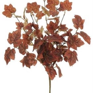May include: A brown artificial maple leaf spray with multiple branches and leaves. The leaves are a mix of brown and green.