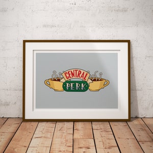 May include: A framed print of the Central Perk logo from the TV show Friends. The logo features two coffee cups with steam rising from them and the text "Central Perk" in red and "PERK" in green.