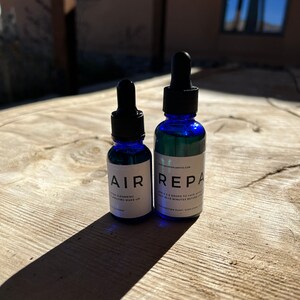 Two bottles of Wrinkle repair face serum.