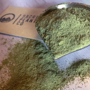 Moringa Powder with Sacred Plant Co logo.