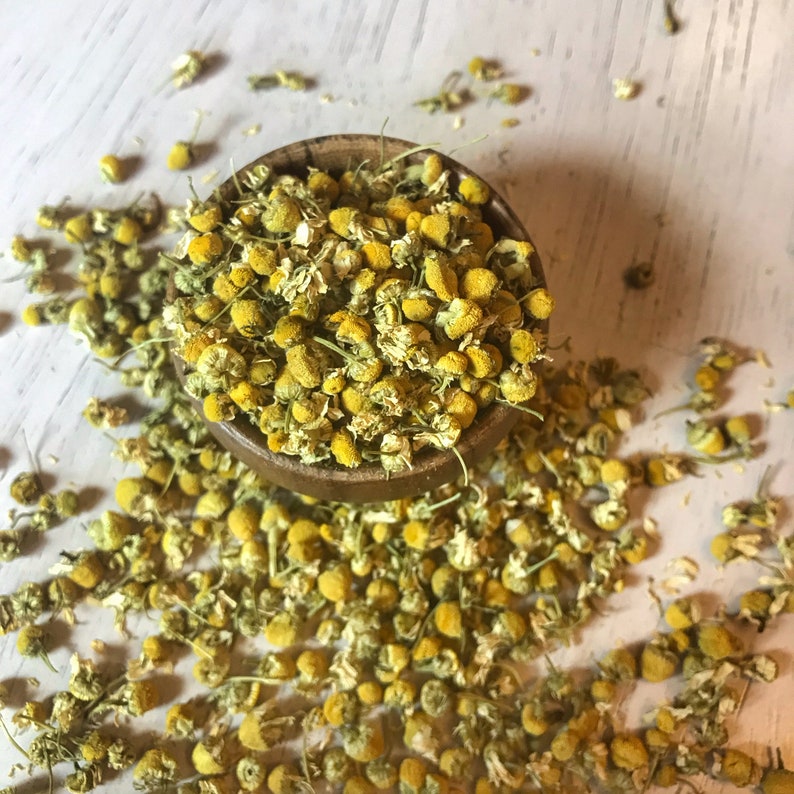 Bulk Chamomile Flowers in a wooden bowl.