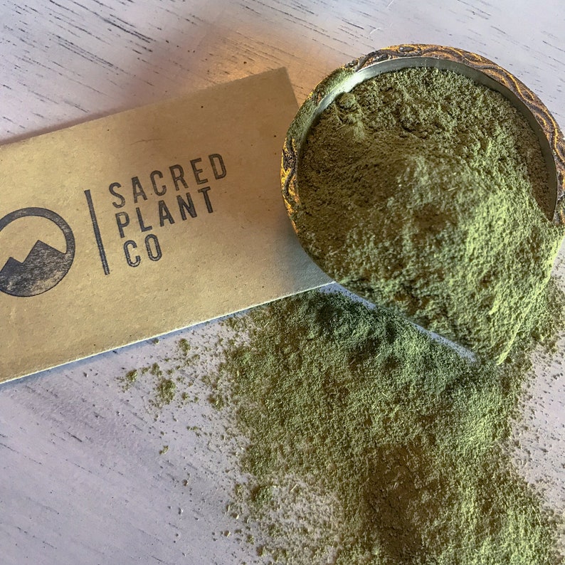 Sacred Plant Co logo with Moringa Powder.