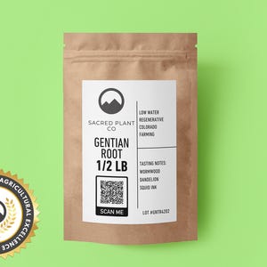 May include: A brown paper bag with a white label that says "Gentian Root 1/2 LB" and "Sacred Plant Co.". The label also includes information about the product's origin and tasting notes. The bag is sitting on a green background.