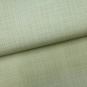 Könnte beinhalten: Nahaufnahme eines hellgrünen Stoffes mit einem dezenten, strukturierten Muster. Der Stoff hat eine gewebte Optik und ein weiches, glattes Gefühl.