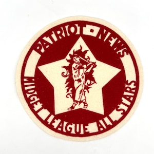 May include: A circular patch with a cream-colored background and a red design. The text "PATRIOT NEWS MIDGET LEAGUE ALL STARS" surrounds a white star with a baseball player illustration.