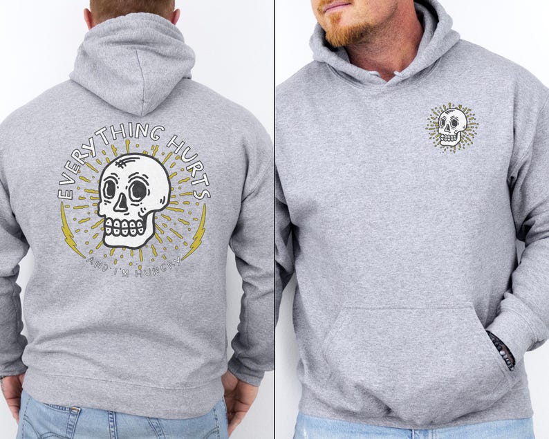 May include: Gray hooded sweatshirt with a skull graphic and the text "EVERYTHING HURTS AND IT'S ALWAYS SUNNY".