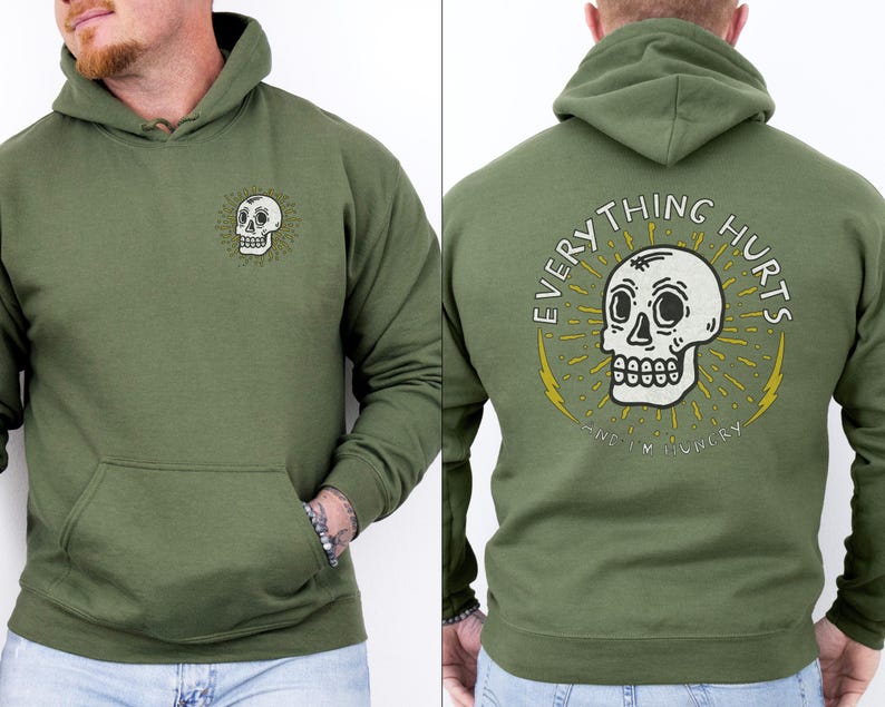 May include: A green hooded sweatshirt with a skull graphic and the text "EVERYTHING HURTS AND I'M HUNGRY".