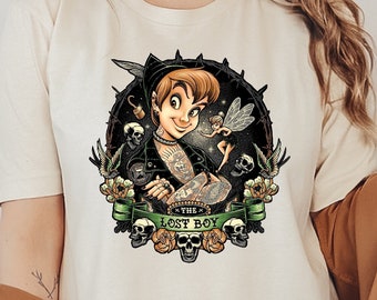 May include: A white t-shirt with a graphic of Peter Pan as a tattooed punk rocker with Tinkerbell on his shoulder. The graphic is surrounded by skulls, roses, and a banner that reads "The Lost Boy".