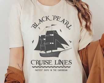 May include: A white t-shirt with a black and gray graphic of a ship with the text "Black Pearl Cruise Lines" and "Fastest Ships in the Caribbean".