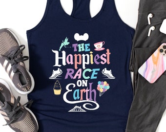 May include: A navy blue tank top with a white graphic that says "The Happiest Race on Earth". The graphic includes a Mickey Mouse head, a teacup, a running shoe, an ice cream cone, and a hot air balloon.