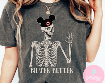 Może przedstawiać: Szary T-shirt z szkieletem w czapce Myszki Miki i napisem "Never Better".