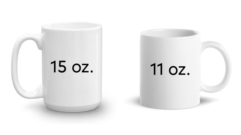 May include: Two white ceramic mugs, one with "15 oz." printed on it and the other with "11 oz." printed on it.