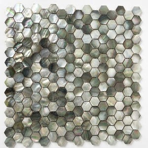 May include: A mosaic tile sheet composed of numerous hexagonal tiles. The tiles have a pearlescent finish with a mix of gray, silver, and iridescent hues. The pattern is uniform, creating a visually appealing surface suitable for various design applications.