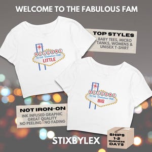 May include: Two white t-shirts with a graphic of a sign that says "Welcome to the Fabulous Fam". One shirt says "Little" and the other says "Big". The shirts have a retro design with blue, red, and gold accents.