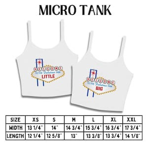 May include: Two white micro tank tops with spaghetti straps. Each top features a design resembling the Las Vegas sign, with the text "WELCOME TO THE Fabulous FAM" and the words "LITTLE" and "BIG". Size chart included.