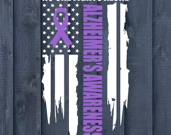 May include: A purple ribbon with a white star background and the text "No One Fights Alone" and "Alzheimer's Awareness" on a distressed American flag design.
