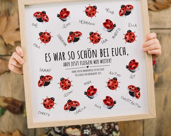 May include: A white framed poster with a red ladybug theme. The poster says "Es war so schön bei euch, aber jetzt fliegen wir weiter!" and features a ladybug with each child's name written underneath. The poster is a cute way to say goodbye to a classroom of children.