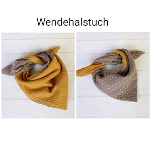May include: A reversible scarf in two styles. One side is mustard yellow, the other is brown with white polka dots. The scarf is tied in a knot. The text "Wendehalstuch" is at the top.