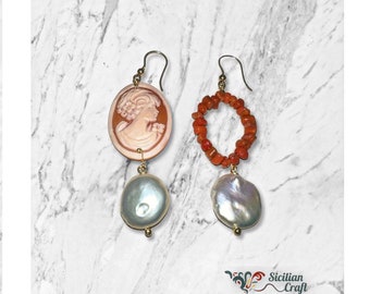 Different earrings with coral cameo and freshwater pearls