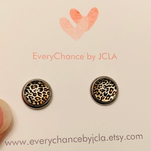 Leopard stud earrings set on silver stainless steel posts.