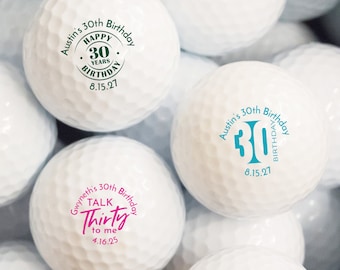 May include: A collection of white golf balls with personalized birthday messages. The messages include "Austin's 30th Birthday", "Happy 30 Years Birthday 8.15.21", "Gwyneth's 30th Birthday Talk Thirty to me 4.16.25", and "Austin's 30th Birthday 8.15.21".