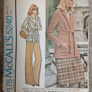 May include: Vintage McCall's pattern envelope featuring illustrations of a sweater jacket, skirt, and pants. The envelope shows a woman in a belted jacket and plaid skirt. The text on the envelope reads "Misses' Unlined Sweater Jacket, Skirt and Pants".