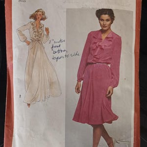 May include: Vintage Simplicity sewing pattern 9655, featuring illustrations of two dresses. The pattern includes sizes 18 and 20. The cover has text that reads "CONTAINS TWO SIZES" and "MISS". The pattern is for dresses with ruffles and long sleeves.