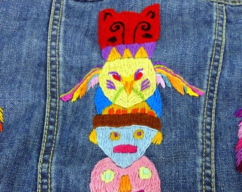 Totem pole and Boho feathers hand stitched embroidered Gymboree size 5-6 denim jean jacket details on front pockets. One of a kind design.