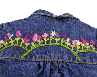 Floral hand stitched embroidered baby denim jean jacket. Size 6mo. Back, front shoulders and cuff design. One of a kind design