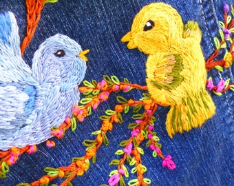 Hand embroidered YMI kid's medium jean jacket. Flowers and birds with front working pocket details. One of a kind unique design.