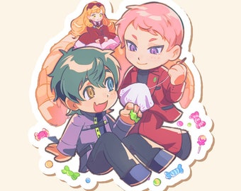 May include: A sticker featuring three cartoon characters. One character has pink hair and a red suit, holding a needle and thread. Another has green hair and a purple outfit, holding a green object. A third character with blonde hair and a red dress sits atop the others.