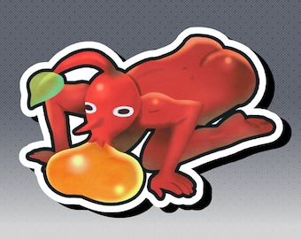 May include: A red cartoon character with a bulbous body, long nose, and white eyes. It is in a crawling position, with a green leaf on its head and a yellow-orange orb in front. The image has a white border with a black outline.