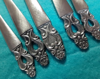 56 piece service for 8 National Stainless Olaf flatware set