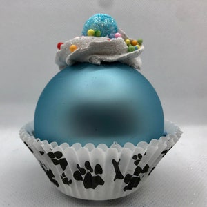 Light blue matte Cupcake ornament with paw and bone cupcake liner for dog, cat or animal lover gift