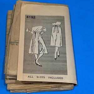 May include: A rustic wooden sign with the text "Welcome to our home" in white lettering. The sign features a distressed finish and a simple, inviting design, perfect for front door decor.