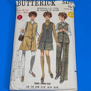 May include: A vintage Butterick sewing pattern for Young Junior/Teen sizes. The pattern packet shows illustrations of three outfits: a vest and skirt, a vest and trouser suit, and a long vest with a dress. Sizes range from 5/6 to 15/16.