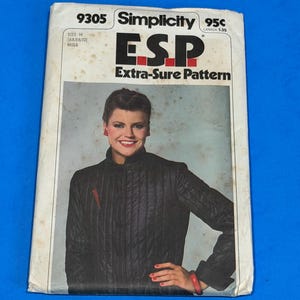 May include: A vintage Simplicity 9305 sewing pattern envelope for a quilted jacket. The front features a photograph of a person wearing a black quilted jacket with a high collar. The text reads 9305, Simplicity, E.S.P. Extra-Sure Pattern, and Size H.