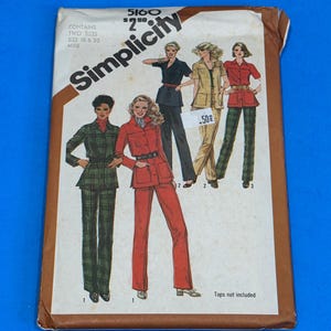 May include: A vintage Simplicity sewing pattern showing illustrations of women's suits in different colours. The pattern includes two sizes, 18 and 20, and the text "Tops not included". The cover has a brown border against a blue background.