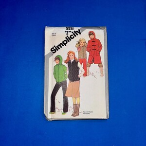 May include: Vintage Simplicity sewing pattern for children's clothing. The pattern features illustrations of a green hooded jacket, a vest with a skirt, and a red coat. The pattern number is 5251, and the size is 4.