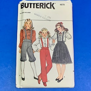 May include: A vintage Butterick sewing pattern packet featuring illustrations of three young girls in different outfits. The outfits include blouses, suspenders, pants, and a skirt. The packet is white with the Butterick logo and pattern number 4679.