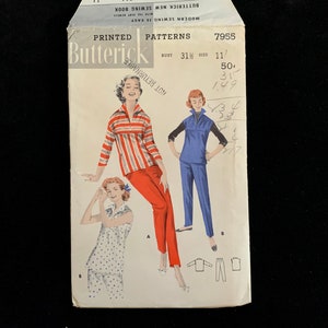 May include: A vintage Butterick sewing pattern envelope with illustrations of women's clothing designs. The envelope shows a red and white striped top with red trousers, a blue top with blue trousers, and a polka dot pajama set. The text "PRINTED PATTERNS" is visible.