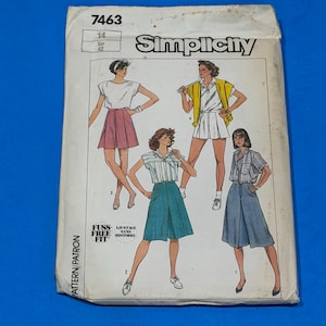 May include: A Simplicity sewing pattern envelope numbered 7463, size 14. The front features illustrations of four different outfits including skirts and tops, with the text Fuss Free Fit and Ajustage Sans Histoire printed on the lower left corner.