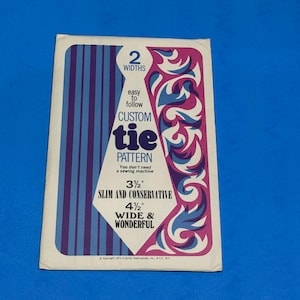 May include: A vintage tie pattern with a blue, purple, and white design. The pattern offers two widths: 3.5" slim and conservative, and 4.5" wide and wonderful. The text reads "Custom Tie Pattern" and "You don't need a sewing machine."