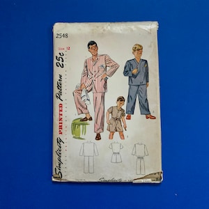 May include: Vintage Simplicity printed pattern 2548, size 12, featuring illustrations of pajama sets and sleepwear. The cover shows men's and boys' sleepwear designs in various styles. The pattern is printed on paper and includes the text "Simplicity is America's Fashion".
