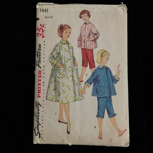 May include: Vintage Simplicity pattern 1441, size 8, featuring illustrations of three different pajama sets. The cover shows a girl in a floral robe, another in a striped pajama set, and a third in a blue pajama set. The price is 35¢.