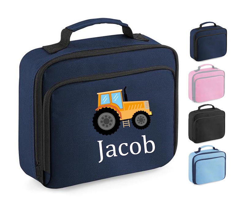May include: A navy blue insulated lunch bag with a yellow tractor and the name "Jacob" embroidered on the front. The bag has a black zipper and a black handle.