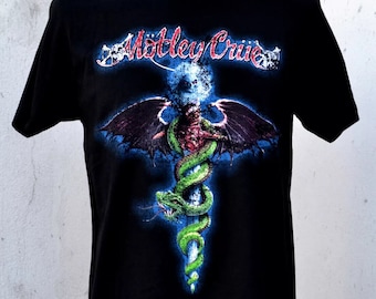 May include: Black t-shirt with a graphic print of a green snake wrapped around a sword with wings. The text "Motley Crue" is printed in red and white on the shirt.