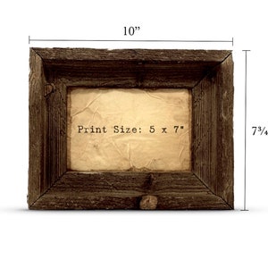 May include: A rustic wooden frame with a 5 x 7 inch print size. The frame is 10 inches wide and 7 3/4 inches tall. The frame is dark brown with a weathered finish.