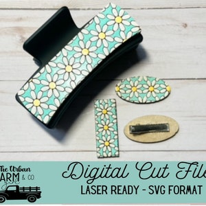 May include: Digital cut file for a hair clip and two smaller hair barrettes. The design features a white daisy pattern on a light blue background. The text "Digital Cut File" and "Laser Ready - SVG Format" is displayed on a light blue background.